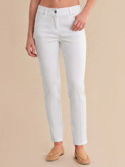 Person wearing white pants on a beige background