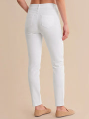 White pants worn by a person on a beige background