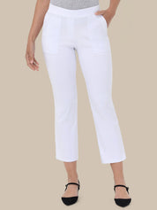 White cropped pants with decorative stitching on the front pockets, shown on a model wearing a gray top and black flat shoes against a solid beige background.