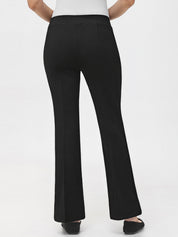 Black pants worn by a person on a white background