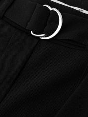 Close-up of a black belt with a silver buckle on a black background