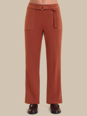 Brown pants with a belt on a beige background