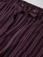 Close-up of a maroon and white striped fabric with a subtle pattern.