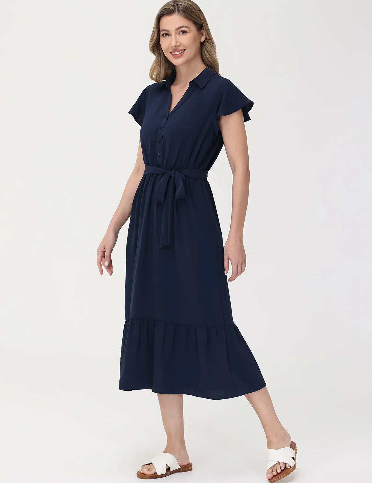 Woman wearing a navy blue dress on a white background