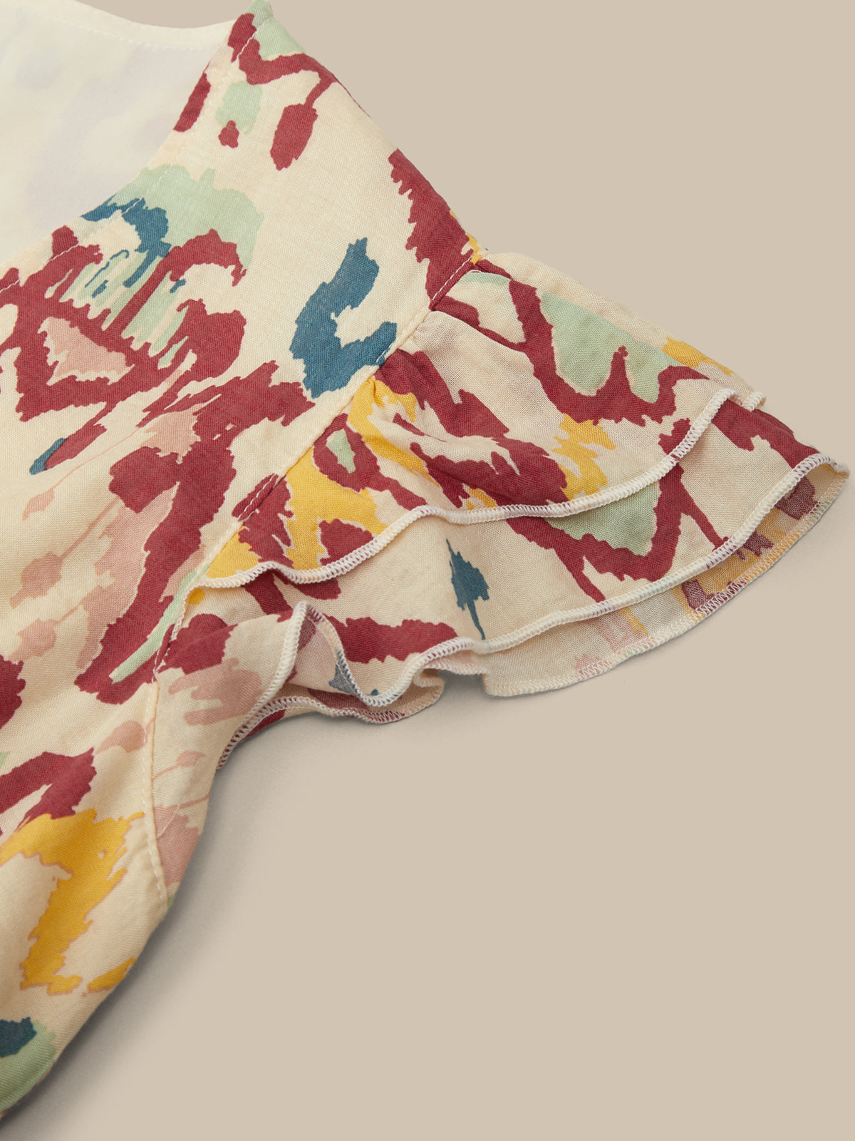 Colorful patterned fabric on a beige background