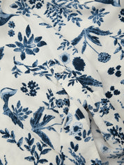 Blue floral pattern on white fabric