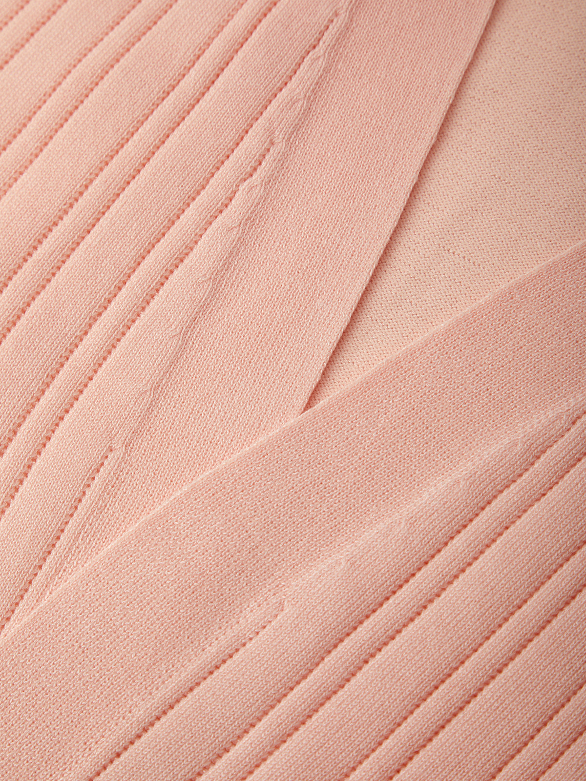 Close-up of pink fabric with pleated texture