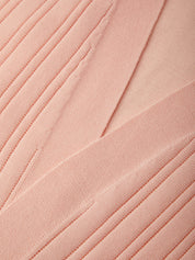 Close-up of pink fabric with pleated texture