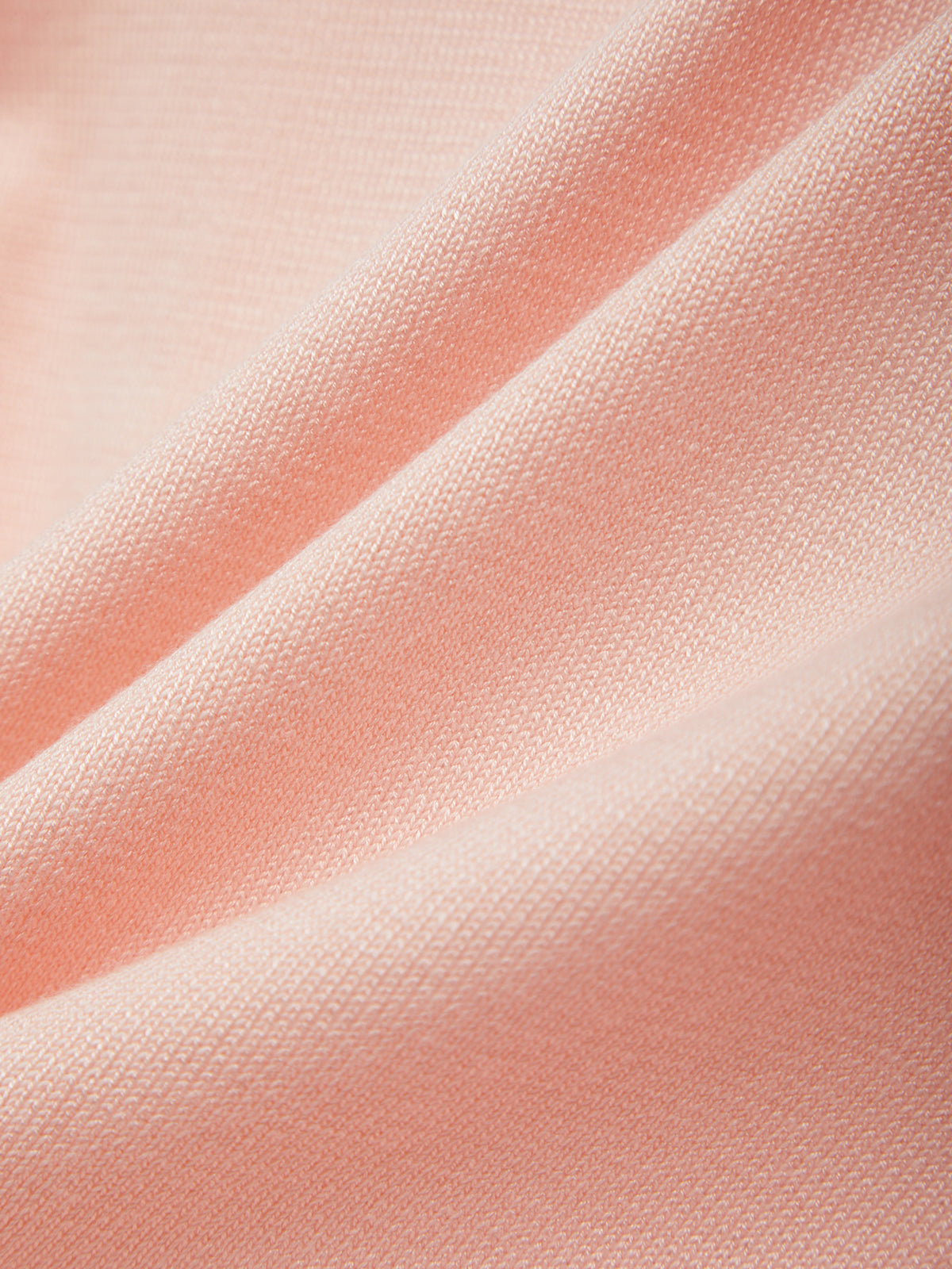 Close-up of pink fabric with folds