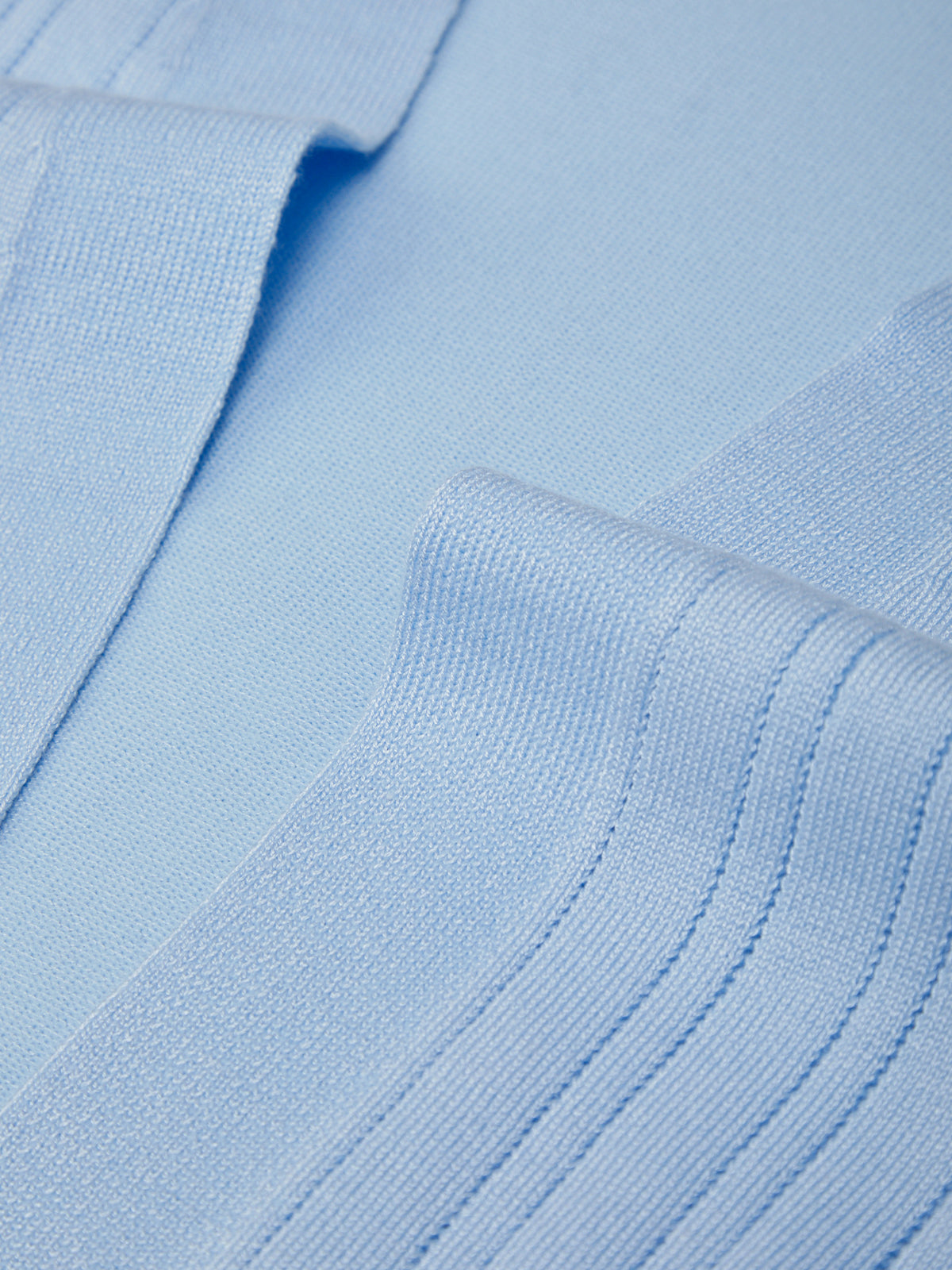 Close-up of light blue fabric with a textured pattern