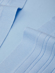 Close-up of light blue fabric with a textured pattern