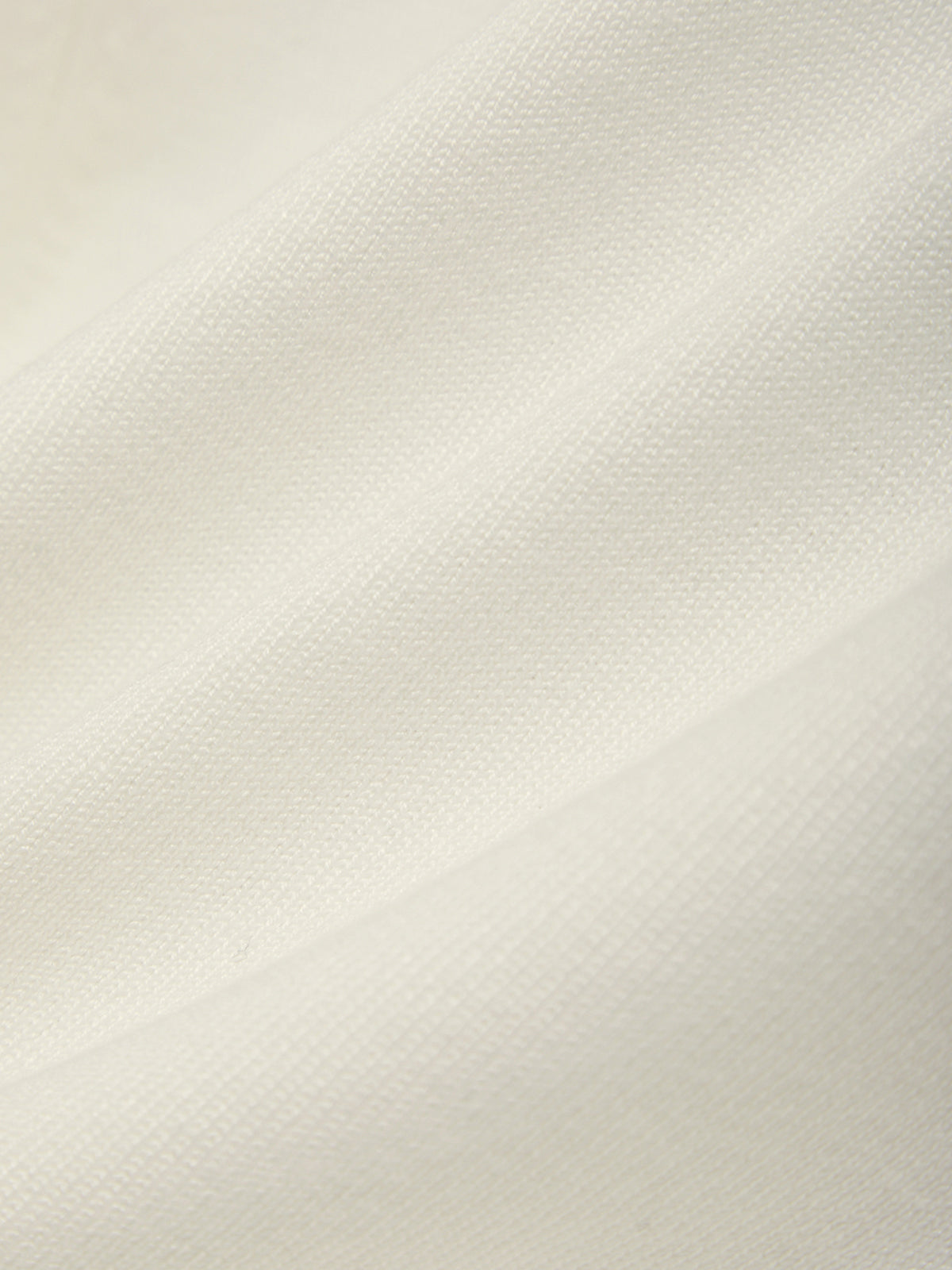Close-up of a textured white fabric surface