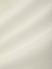Close-up of a textured white fabric surface