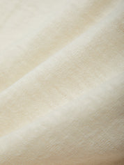 Close-up of beige fabric texture