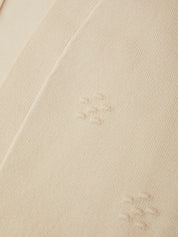 Close-up of beige fabric with visible stains