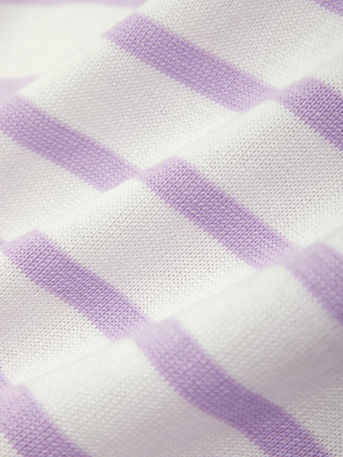 Close-up of fabric with purple checkered pattern