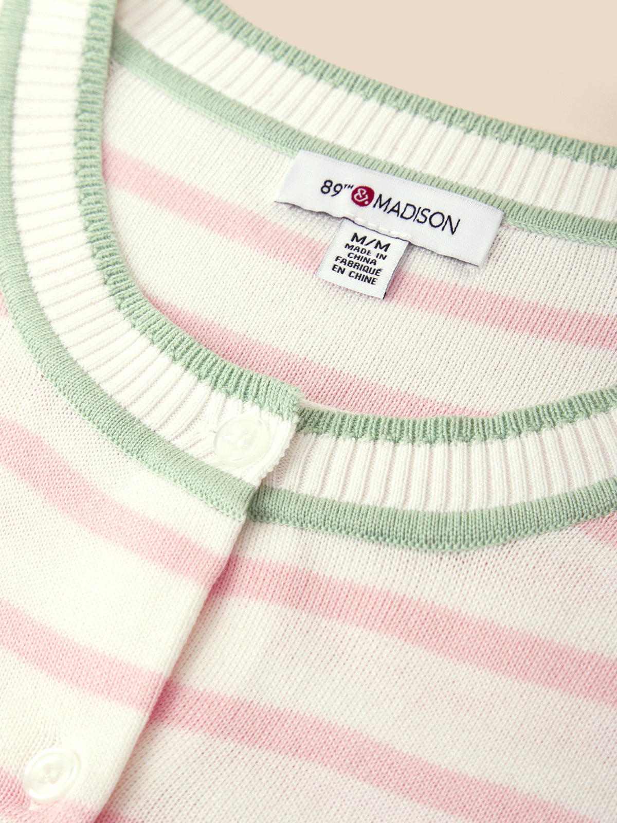 Close-up of a striped garment with a visible brand label.