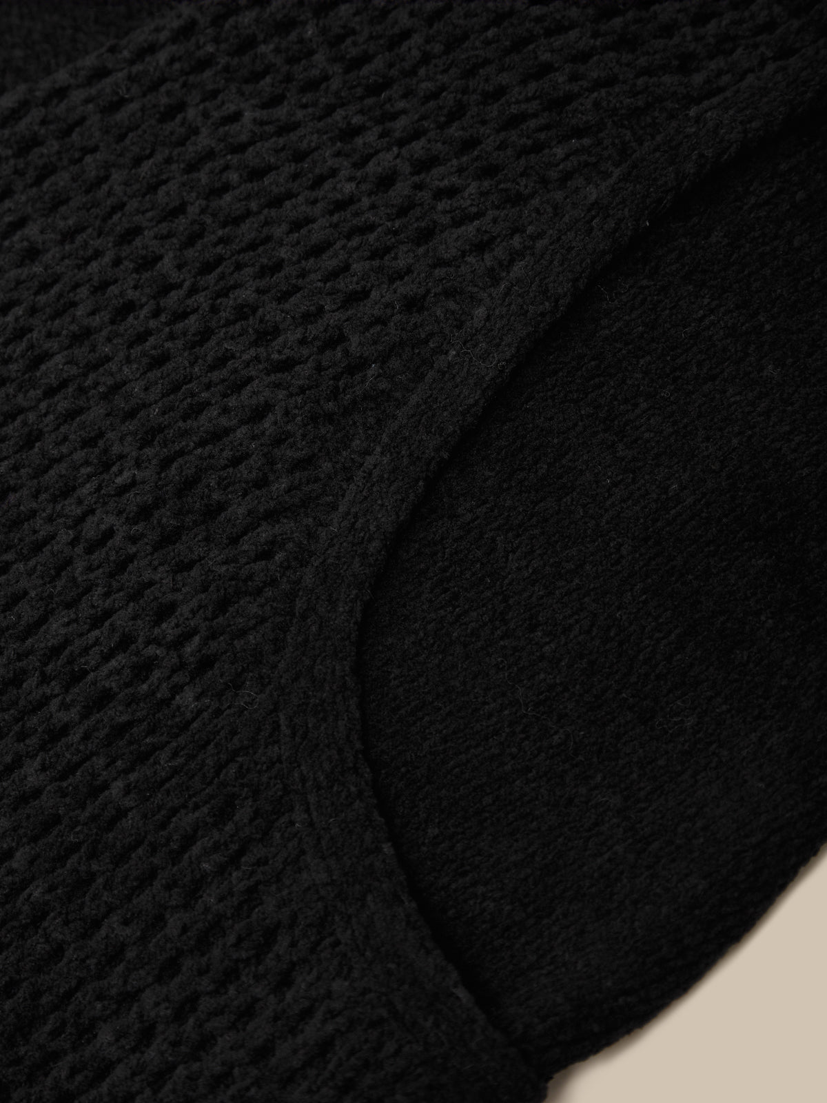 Black hat with a brand label on a white background