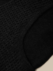 Black hat with a brand label on a white background