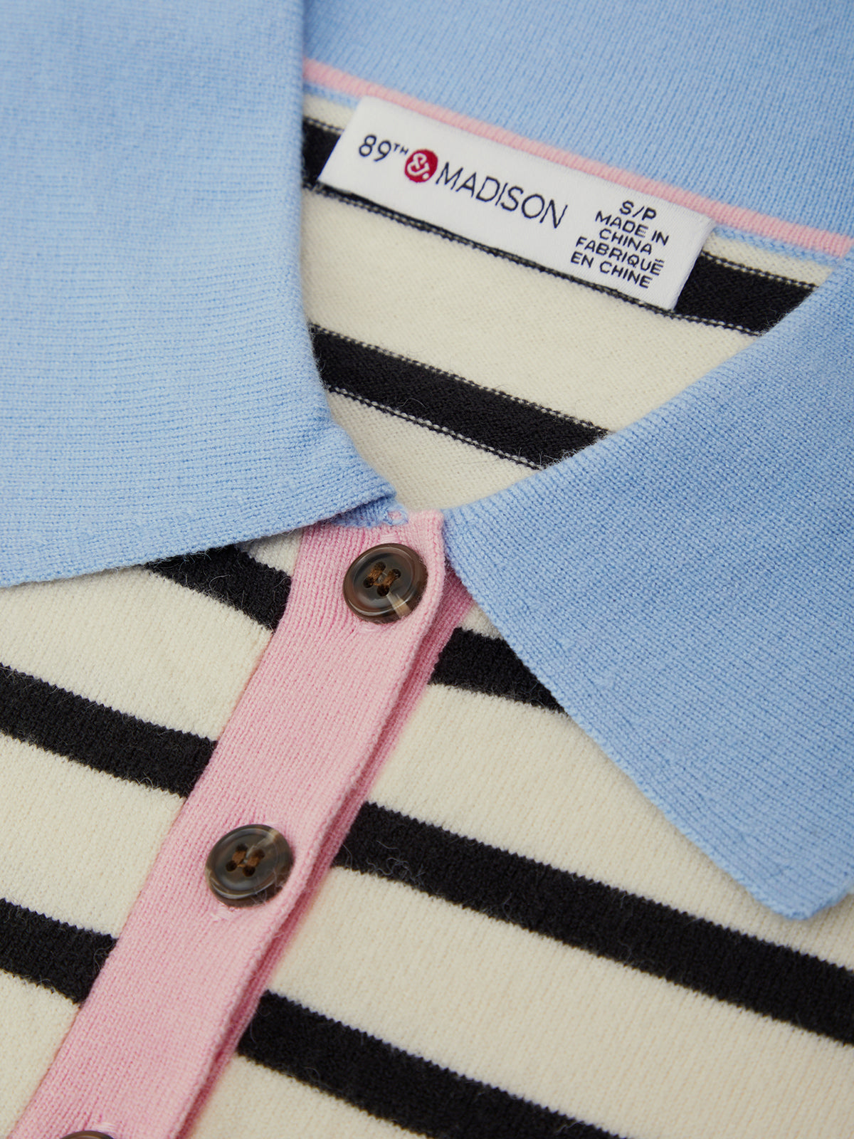 Close-up of a label on a garment with visible brand name and text.