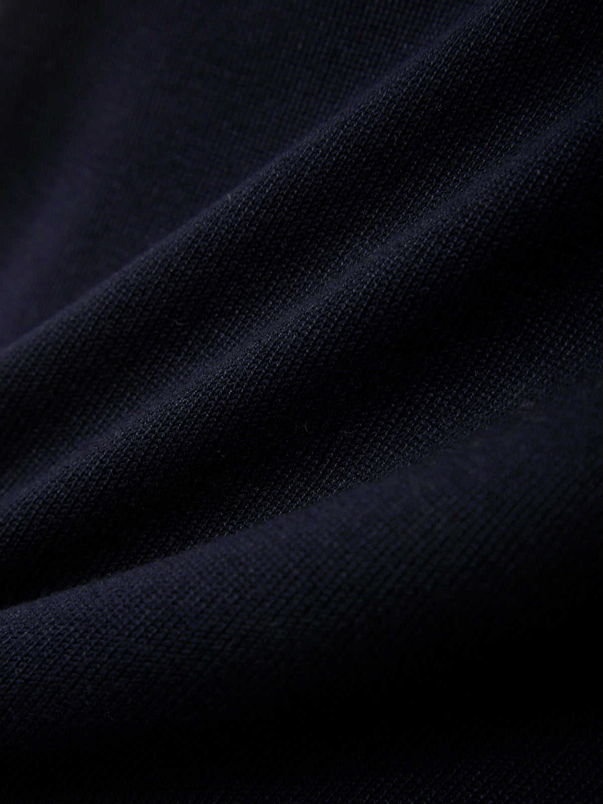 Close-up of dark blue fabric texture