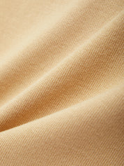 Close-up of beige fabric with subtle texture