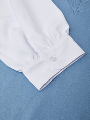 White long-sleeve shirt on a blue textured background
