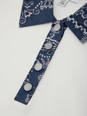 Blue bandana with white patterns and silver buttons on a white background