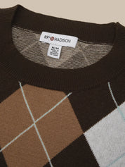 Close-up of a knit sweater neck area showing a white label that reads 89% MADISON. The sweater has a dark brown ribbed collar and upper section with an argyle pattern in brown, tan, and white.