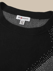 Close-up of a black knit sweater with a gray patterned dotted design on the right side and a visible neck label reading 89 MADISON.