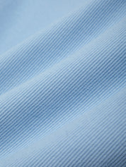 Close-up of blue fabric with a textured pattern