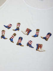 White t-shirt with red, white, and blue cowboy boot designs on a plain background