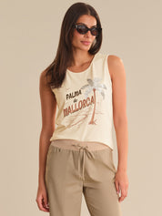 Woman wearing a sleeveless top with 'Palma de Mallorca' text and palm tree design.