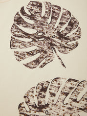 Brown leaf pattern on a beige background