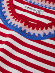 Close-up of a red, white, and blue striped garment with 'Madison' label.
