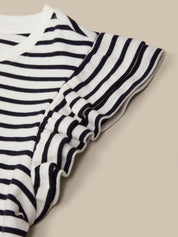 Black and white striped fabric on a beige background