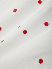 White fabric with red floral patterns