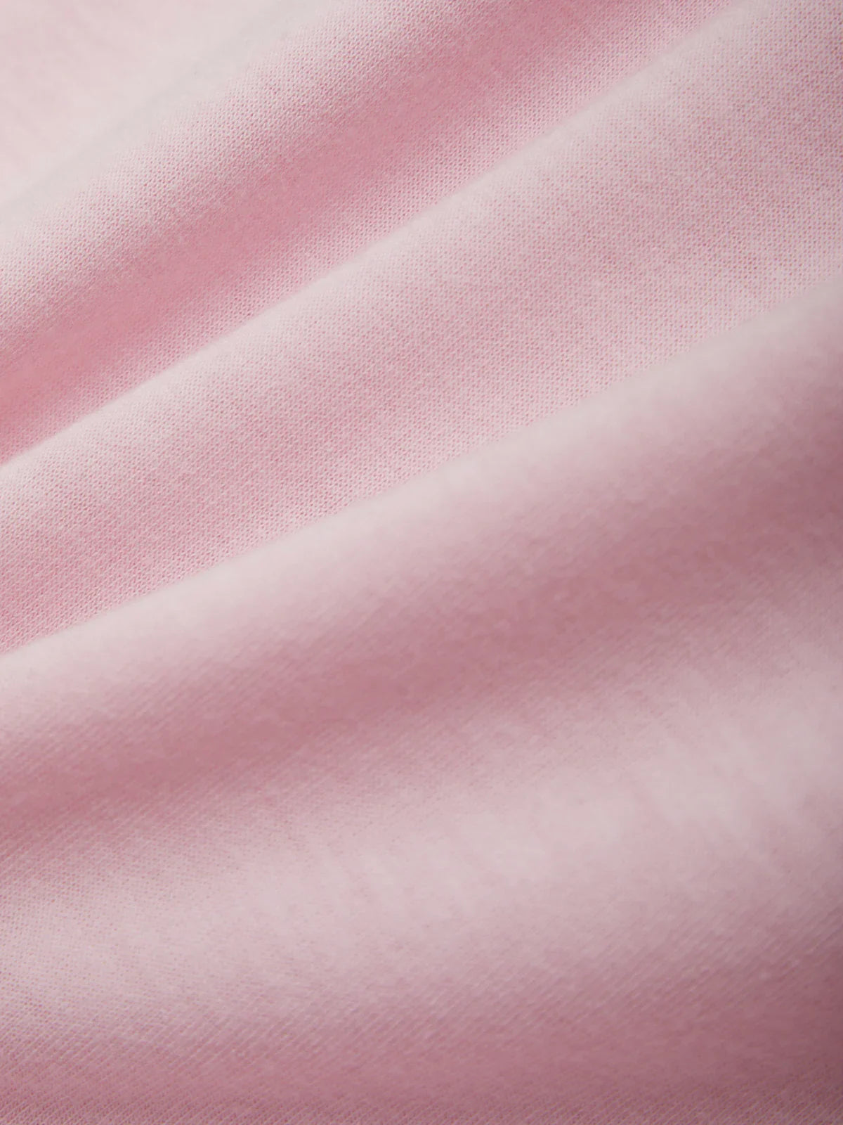 Close-up of pink fabric with a soft texture