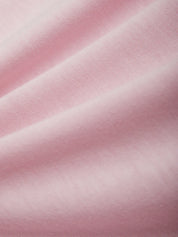 Close-up of pink fabric with a soft texture