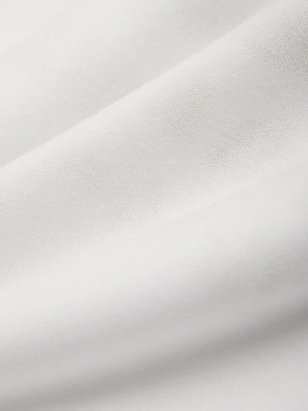 Close-up of a textured white fabric surface