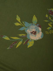 Olive green fabric with a floral print featuring a light blue and cream flower with yellow-green leaves.
