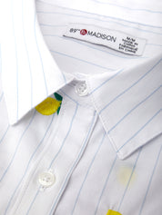 Close-up of a white shirt with blue pinstripes and a 'Madison' label.