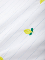 Embroidered lemons on a lined fabric background