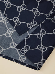 Navy and gray patterned fabric with interwoven design on a beige background
