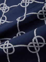 Navy blue fabric with white rope knot pattern