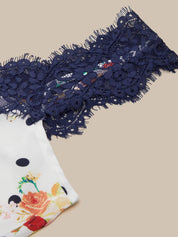 Navy blue lace trim on a beige background