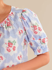 Floral patterned blouse with blue checkered background