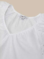 White blouse with ruffled details on a beige background