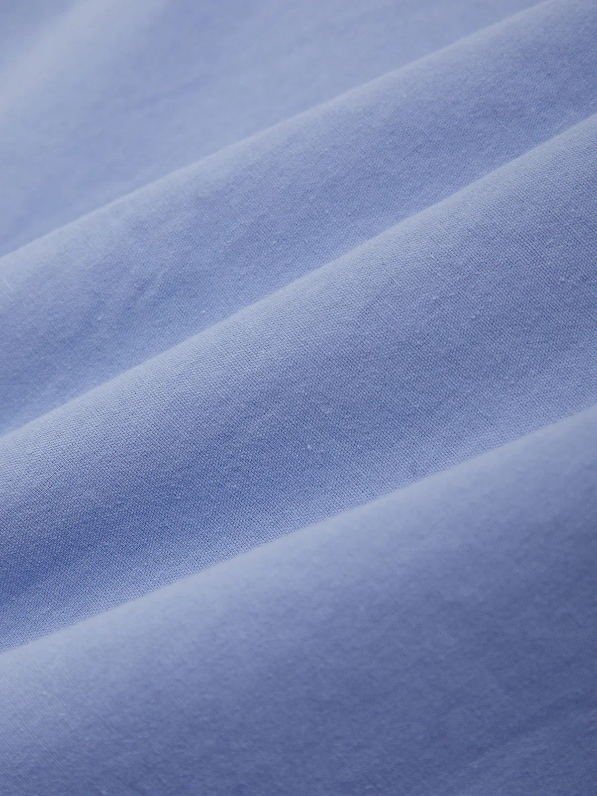 Close-up of blue fabric with visible texture