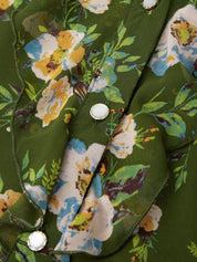 Close-up of a floral patterned fabric with green background